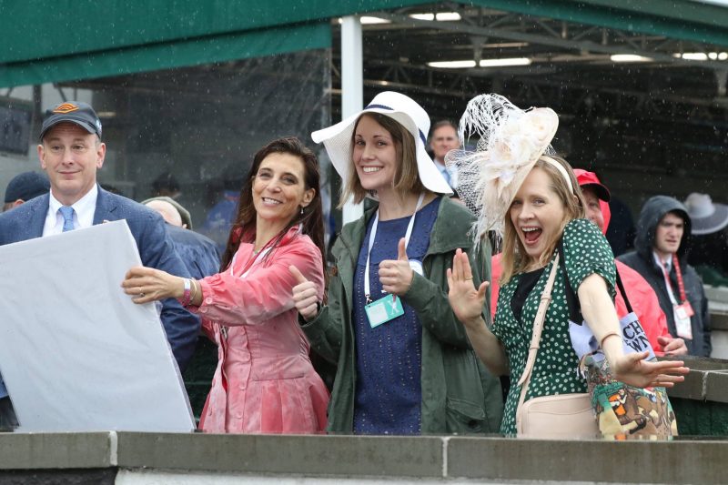 TAA and Audible trying to stay dry before the check presentation at Churchill Downs