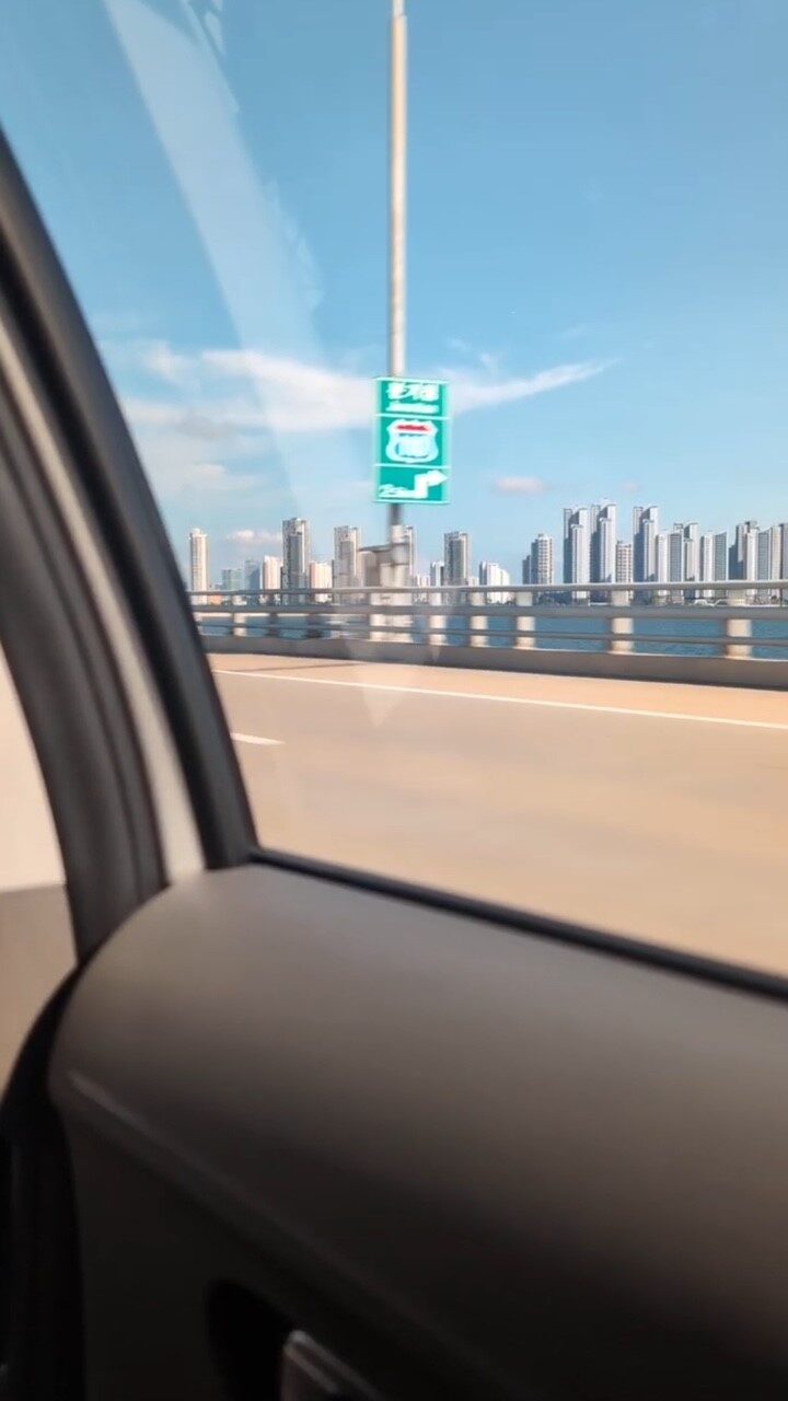 Photo from CJ's trip to South Korea - inside a car looking out the window at the city in South Korea